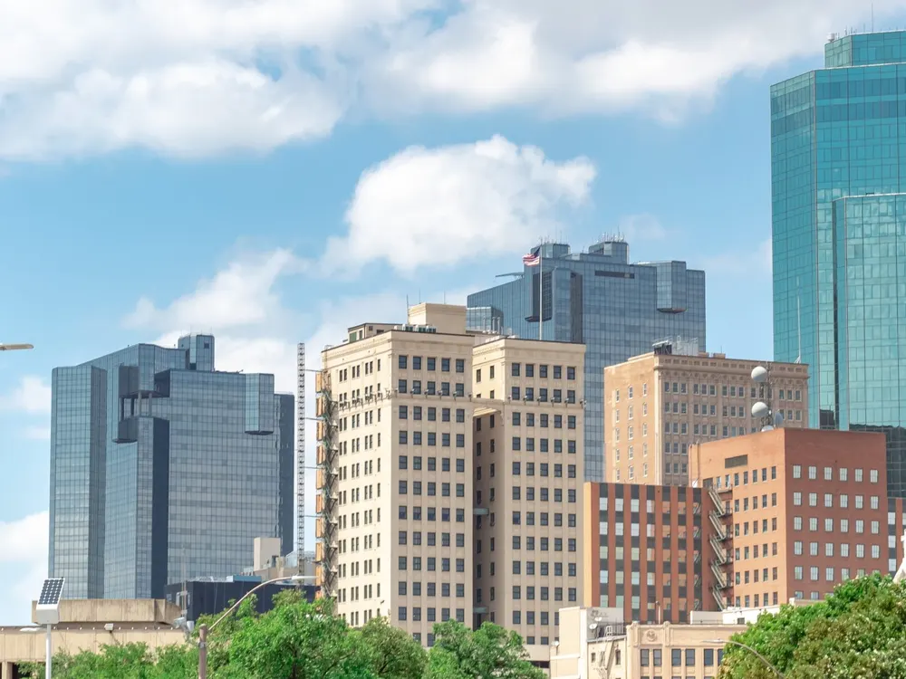 Downtown Fort Worth office towers under a cloudy sky
